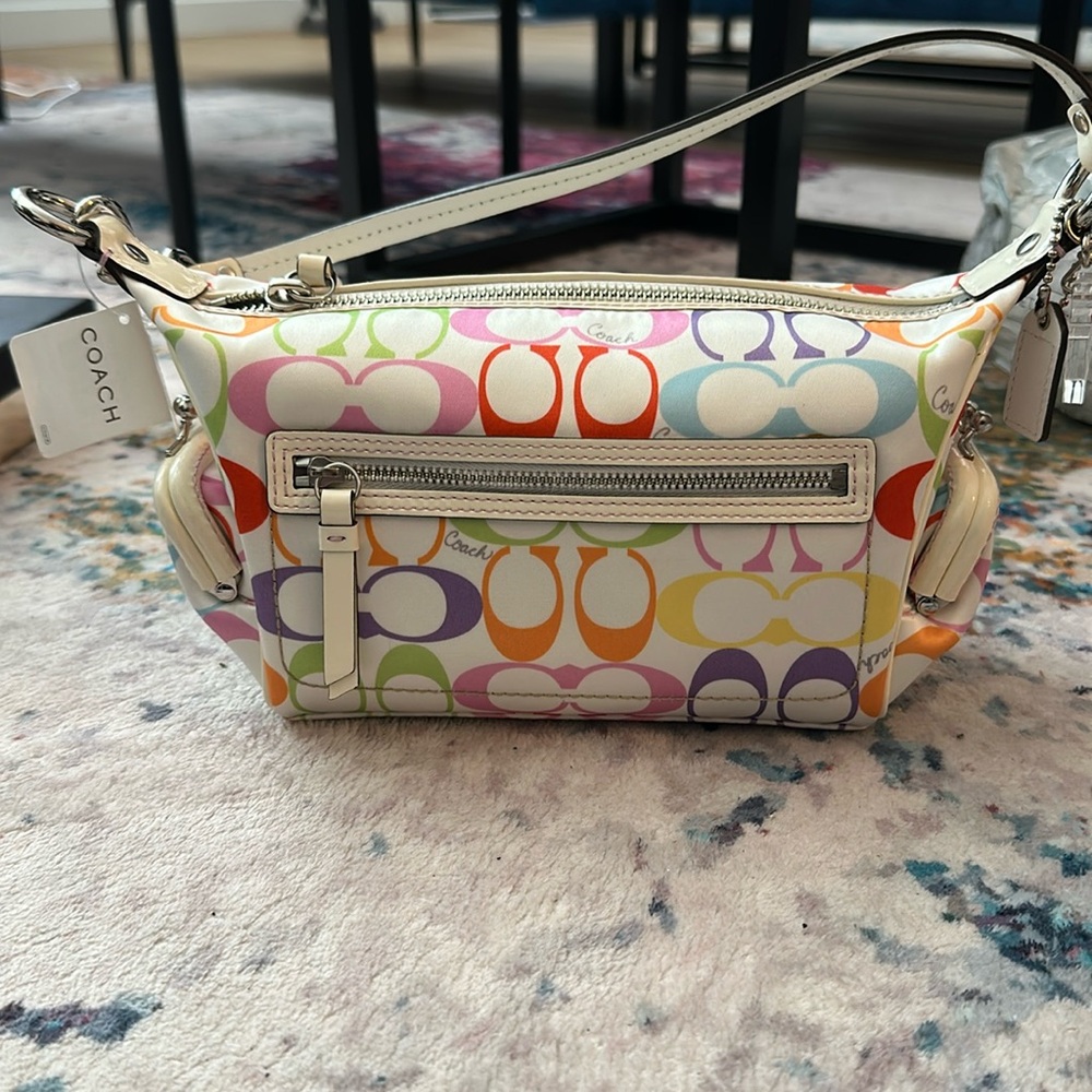 Coach Pouchbag with two side coin purse pockets in colourful Coach logo